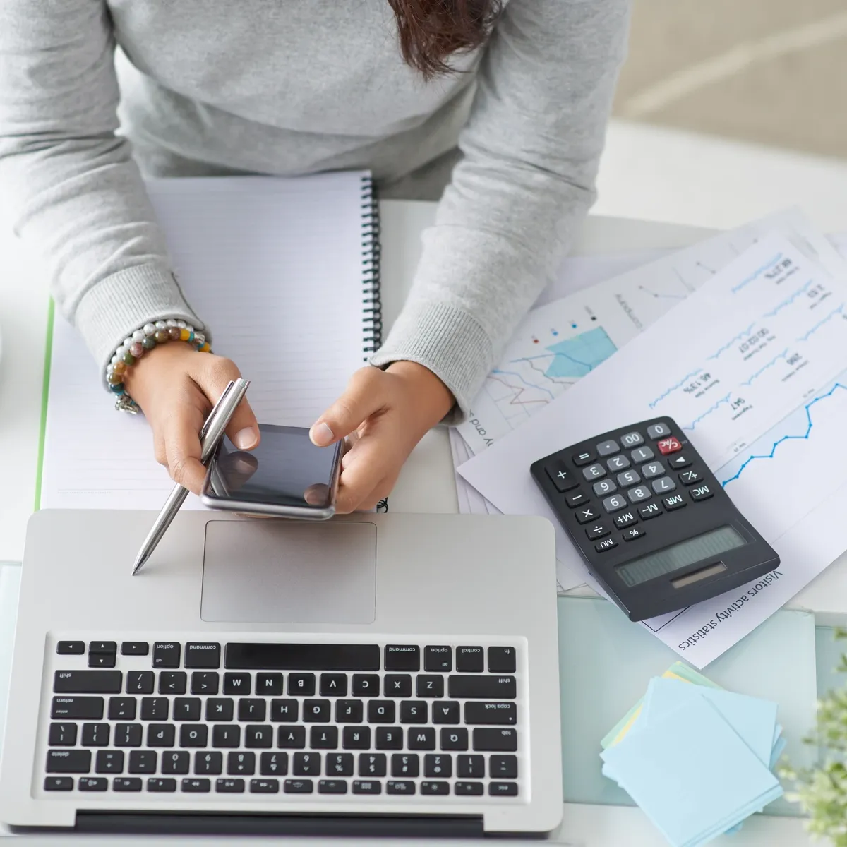 Appledale team member managing property finances at an office desk